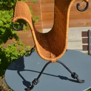 Wrought iron and rattan magazine/newspaper rack