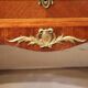 Commode sauteuse ne bois de placage