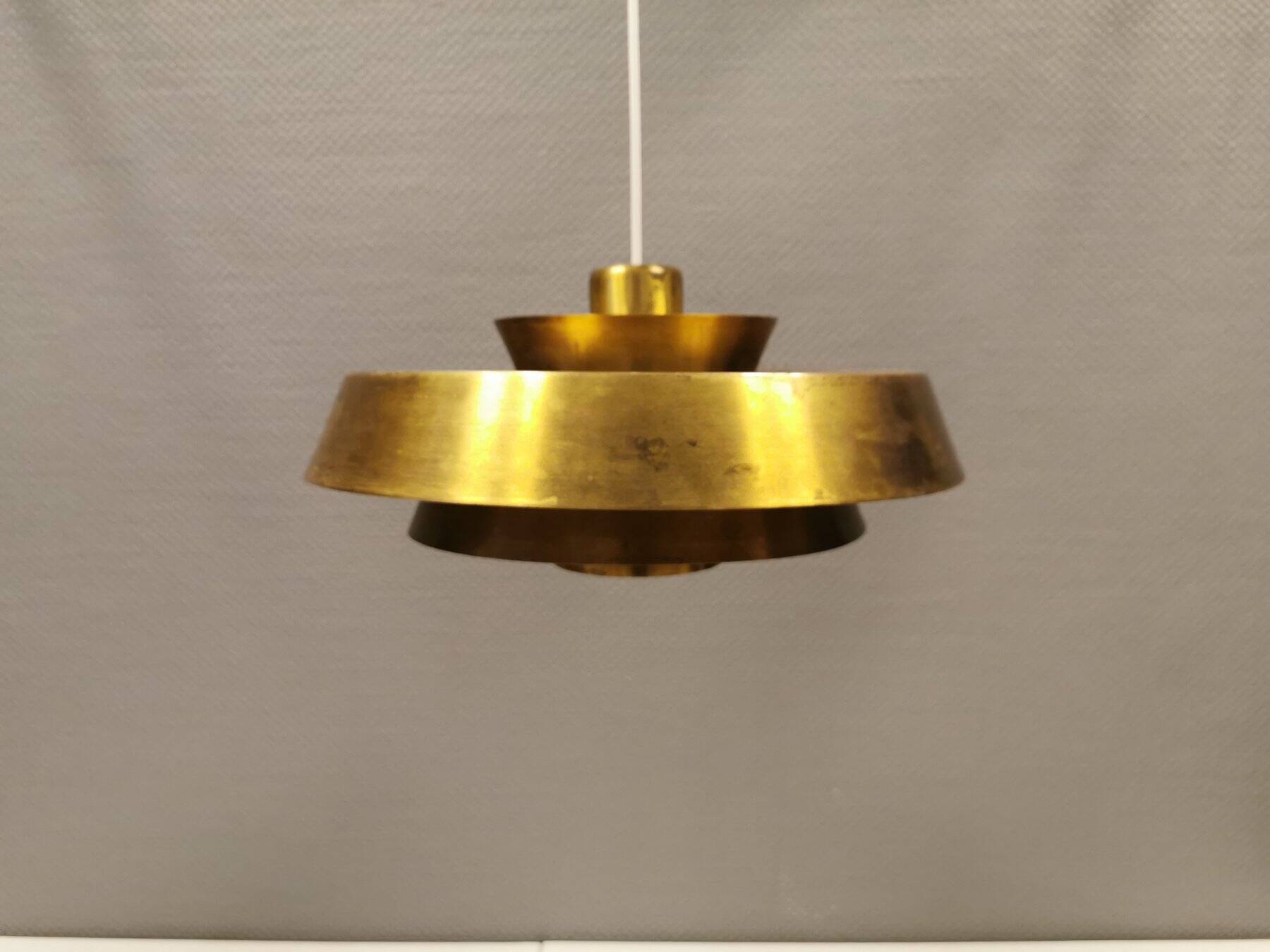 A mid-century Danish hanging lamp in solid brass by Jo Hammerborg for Fog & Mørup.