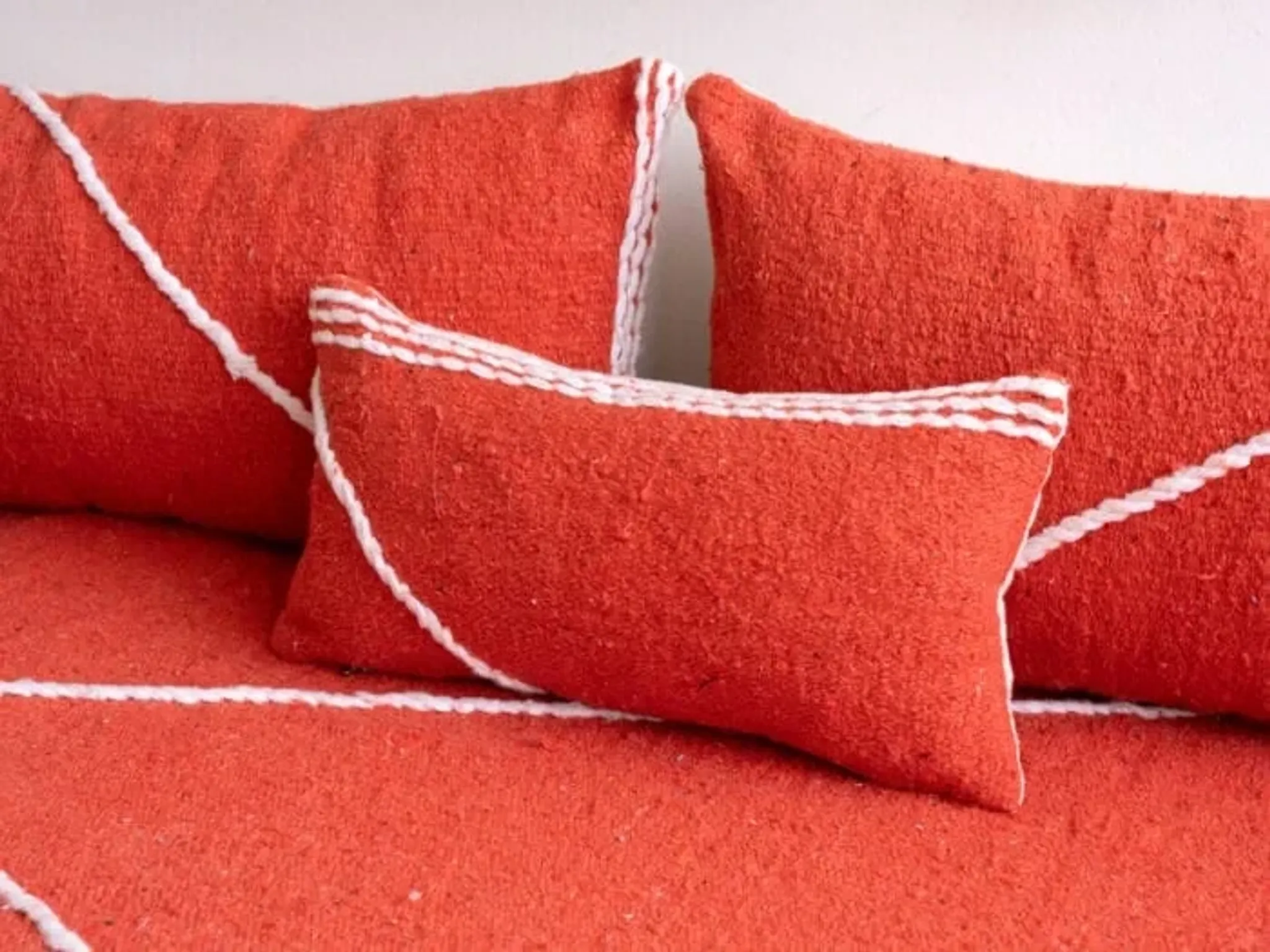 Handmade Moroccan floor cushion in orange cotton.