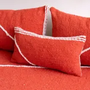 Handmade Moroccan floor cushion in orange cotton.