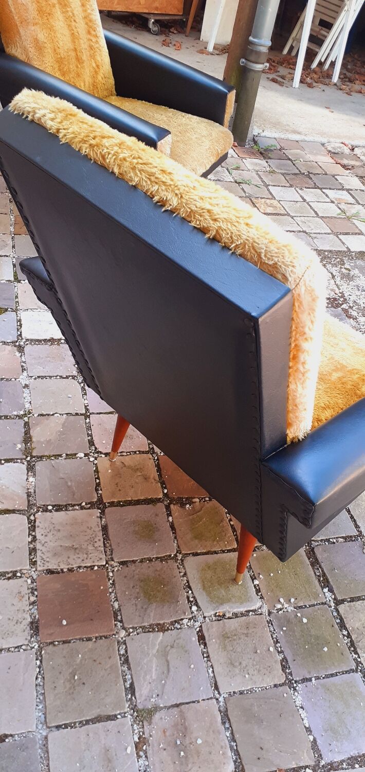 Pair of vintage 60s armchairs in black imitation leather and mustard toffee