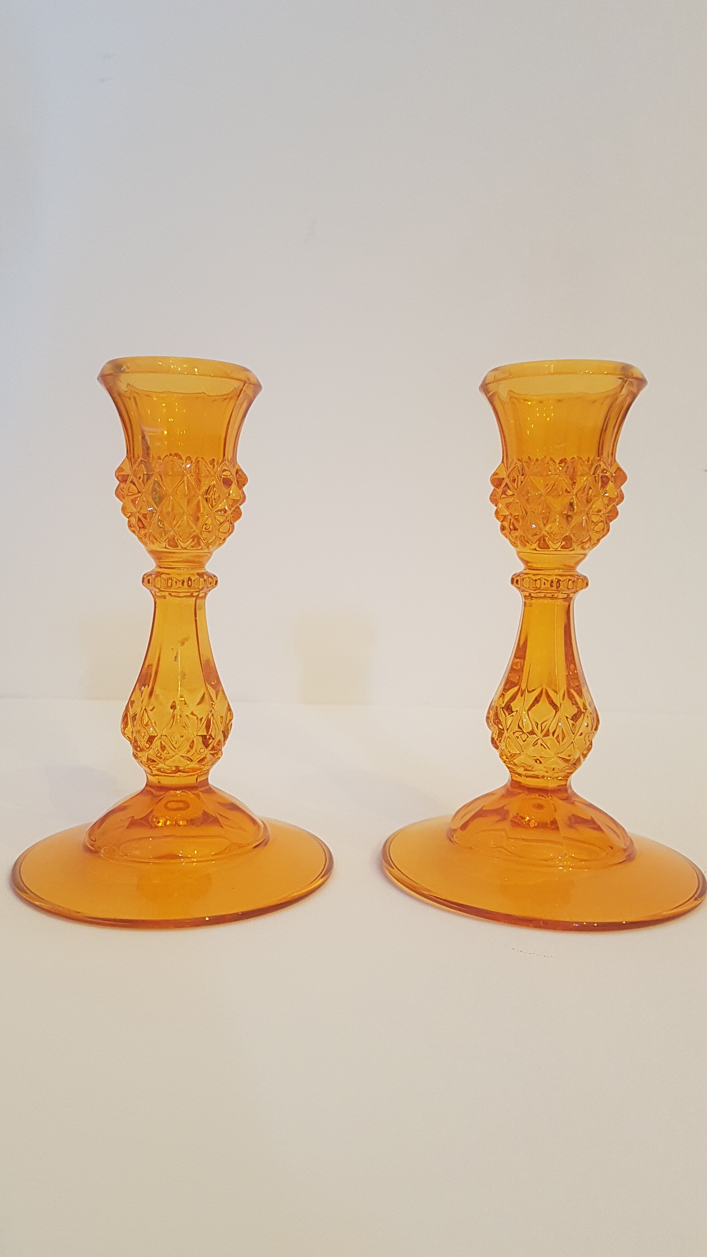Set of 2 orange glass candle holders