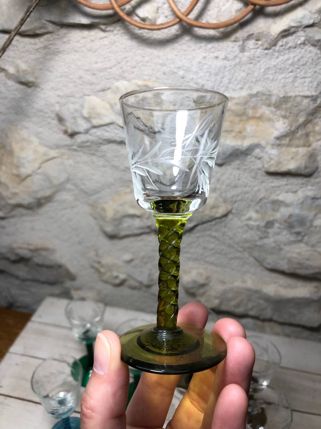 Antique and rare! Sold in a set of 12 colorful twisted stemmed glasses engraved with flowers and leaves