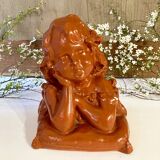 Bust of a pensive child in plaster