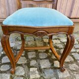 Vintage Louis XV chair made of carved solid wood with blue velvet fabric.