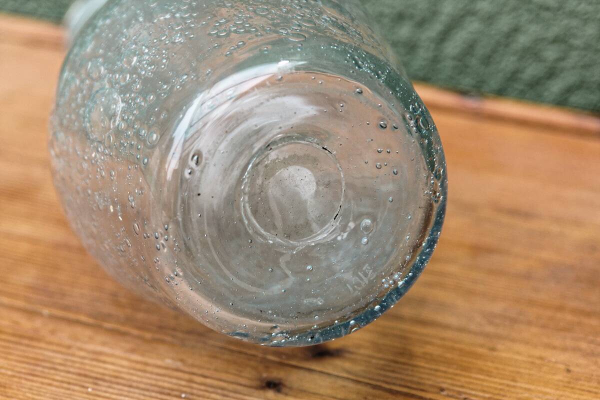 Biot blown glass bottle