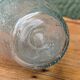 Biot blown glass bottle