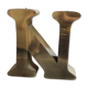 Old letter N of gilded metal sign
