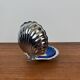 Silver-plated metal shell butter dish with blue insert, 1970