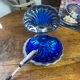 Shell-shaped butter dish in stainless steel and blue glass