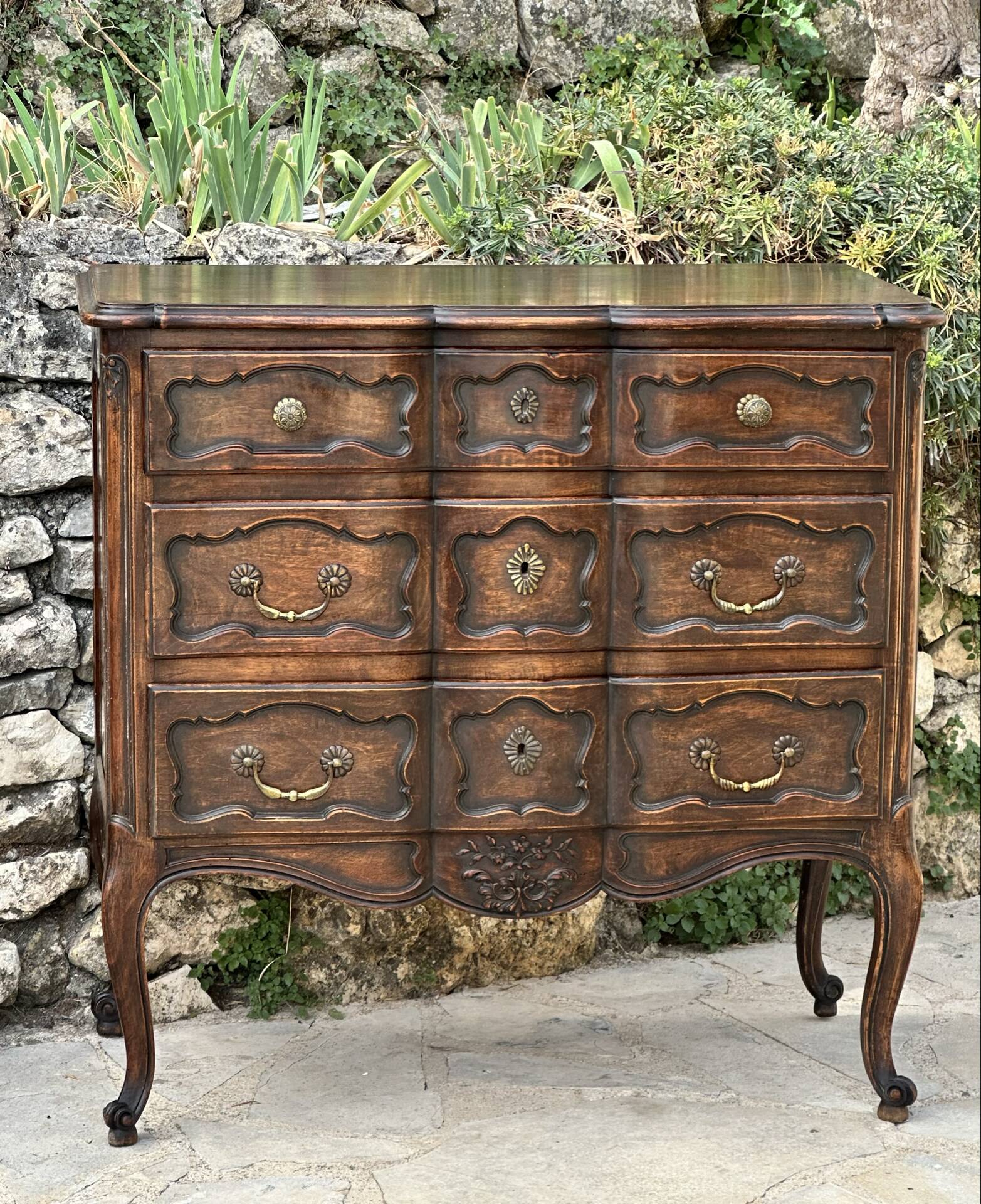 Carved and moulded solid wood commode in the Louis XV style.