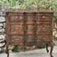 Carved and moulded solid wood commode in the Louis XV style.
