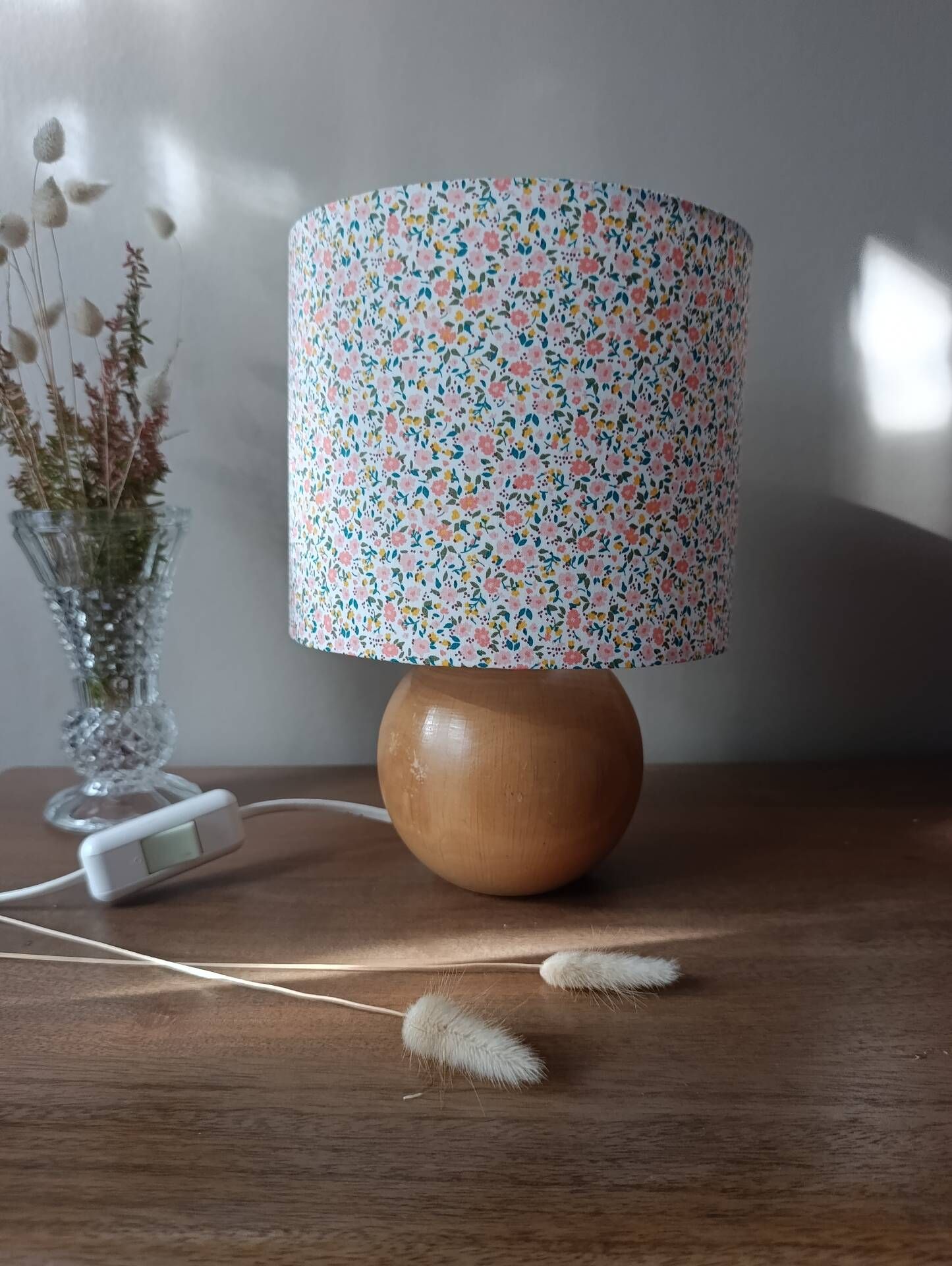 Red bedside lamp, liberty lampshade with small pink flowers.