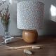 Red bedside lamp, liberty lampshade with small pink flowers.