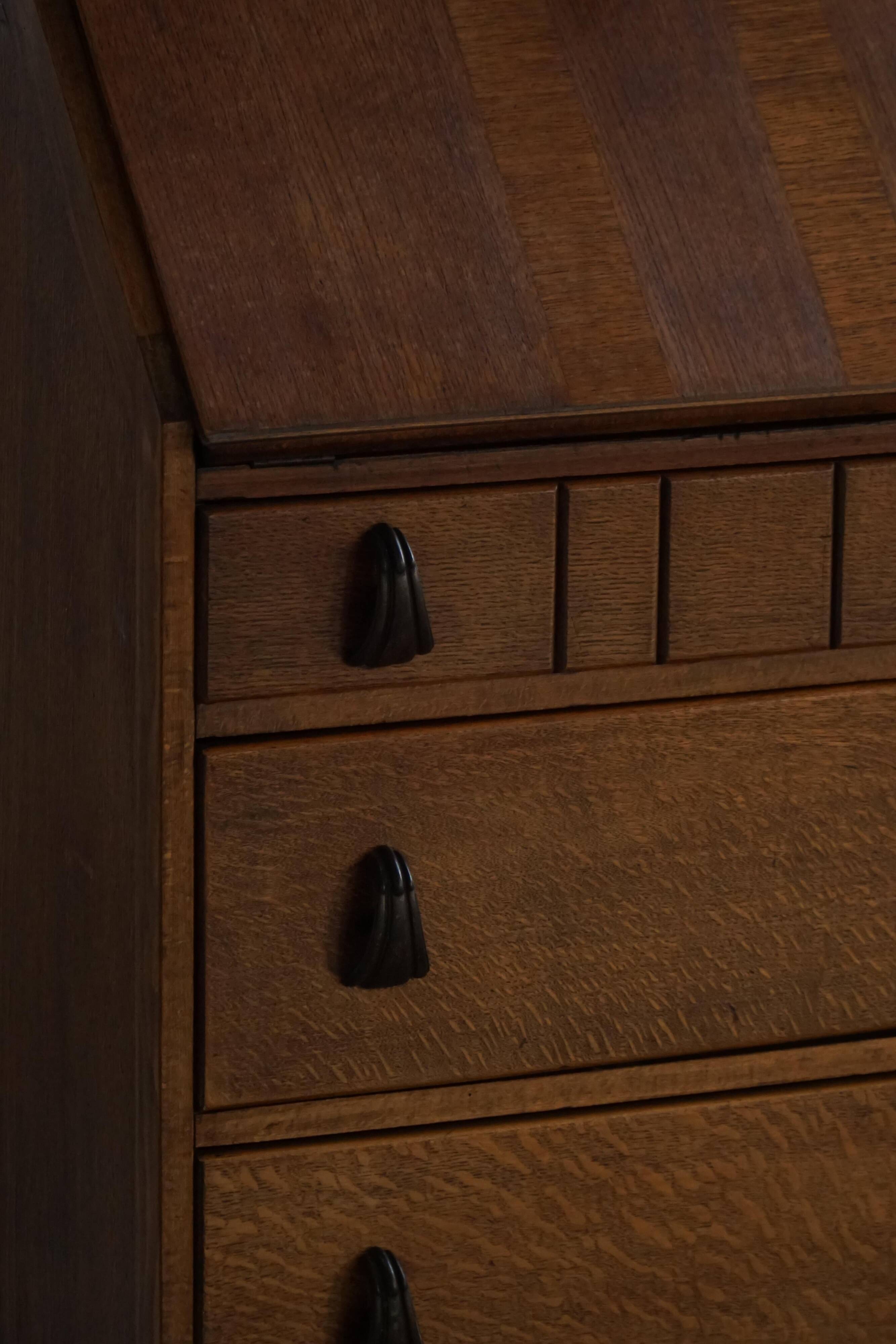 Desk / Chest of drawers in modern Danish oak from the early 20th century with shell handles.