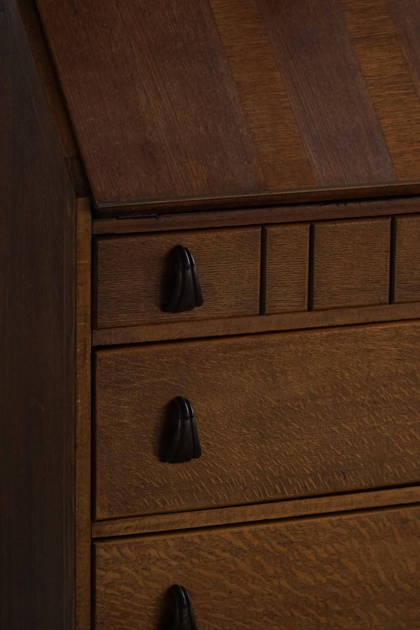 Desk / Chest of drawers in modern Danish oak from the early 20th century with shell handles.
