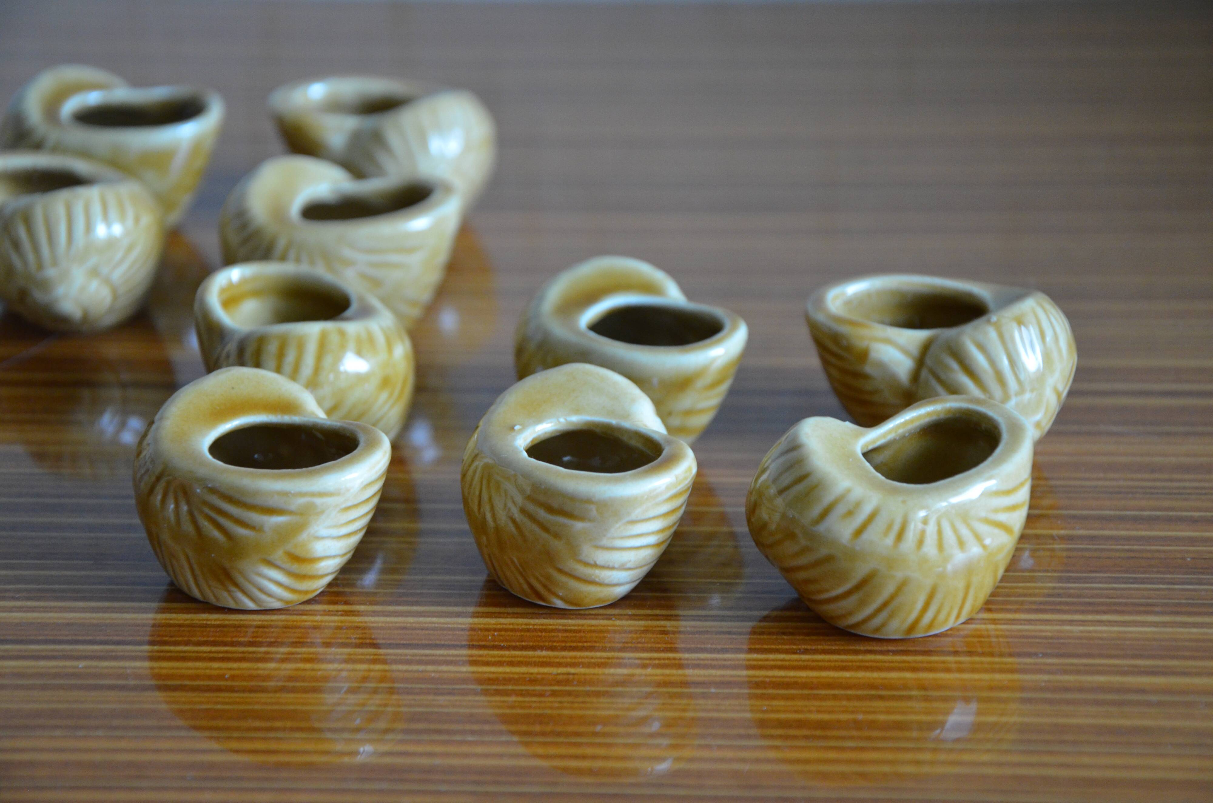 Lot of 12 enamelled sandstone snail shells