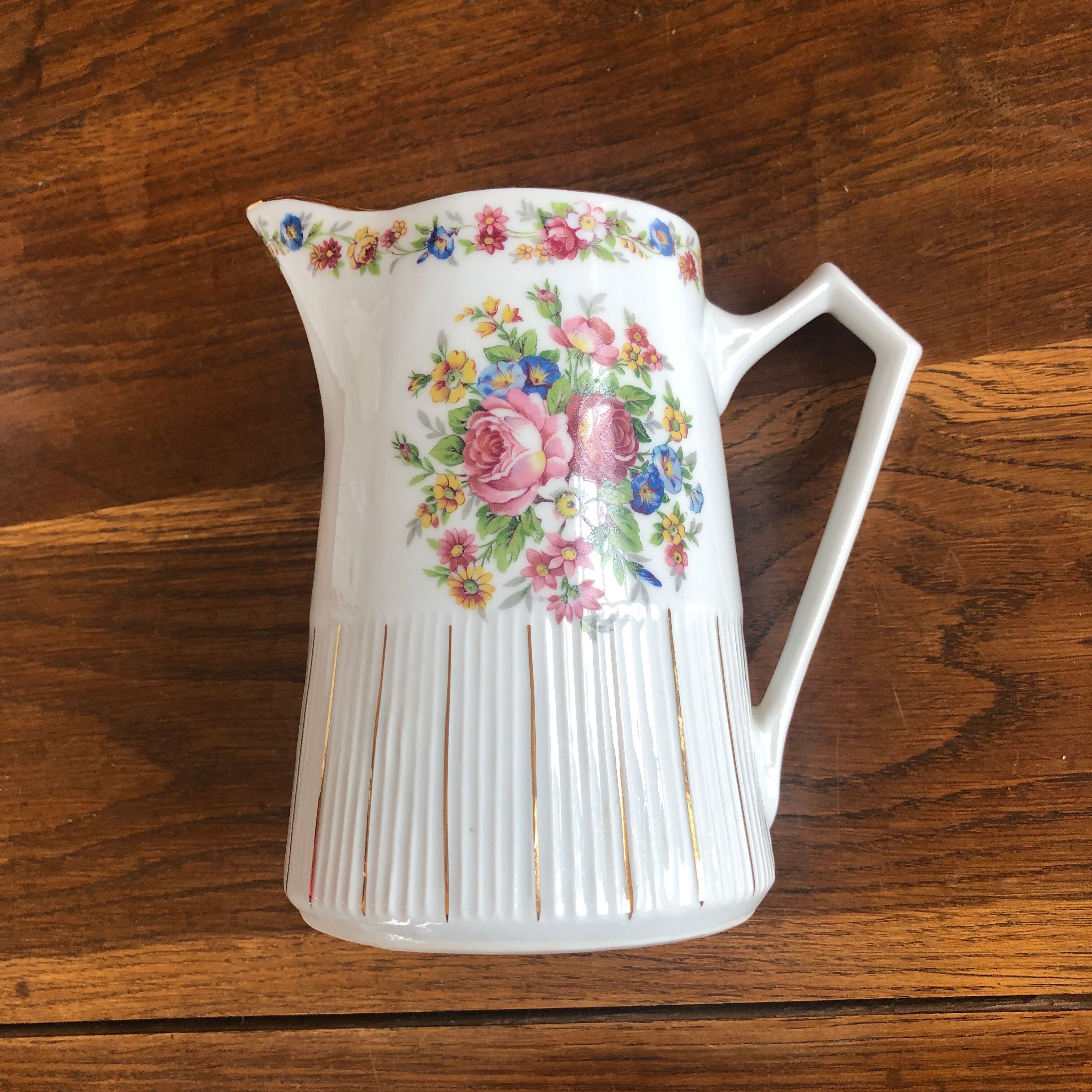 Porcelain pitcher with flowers