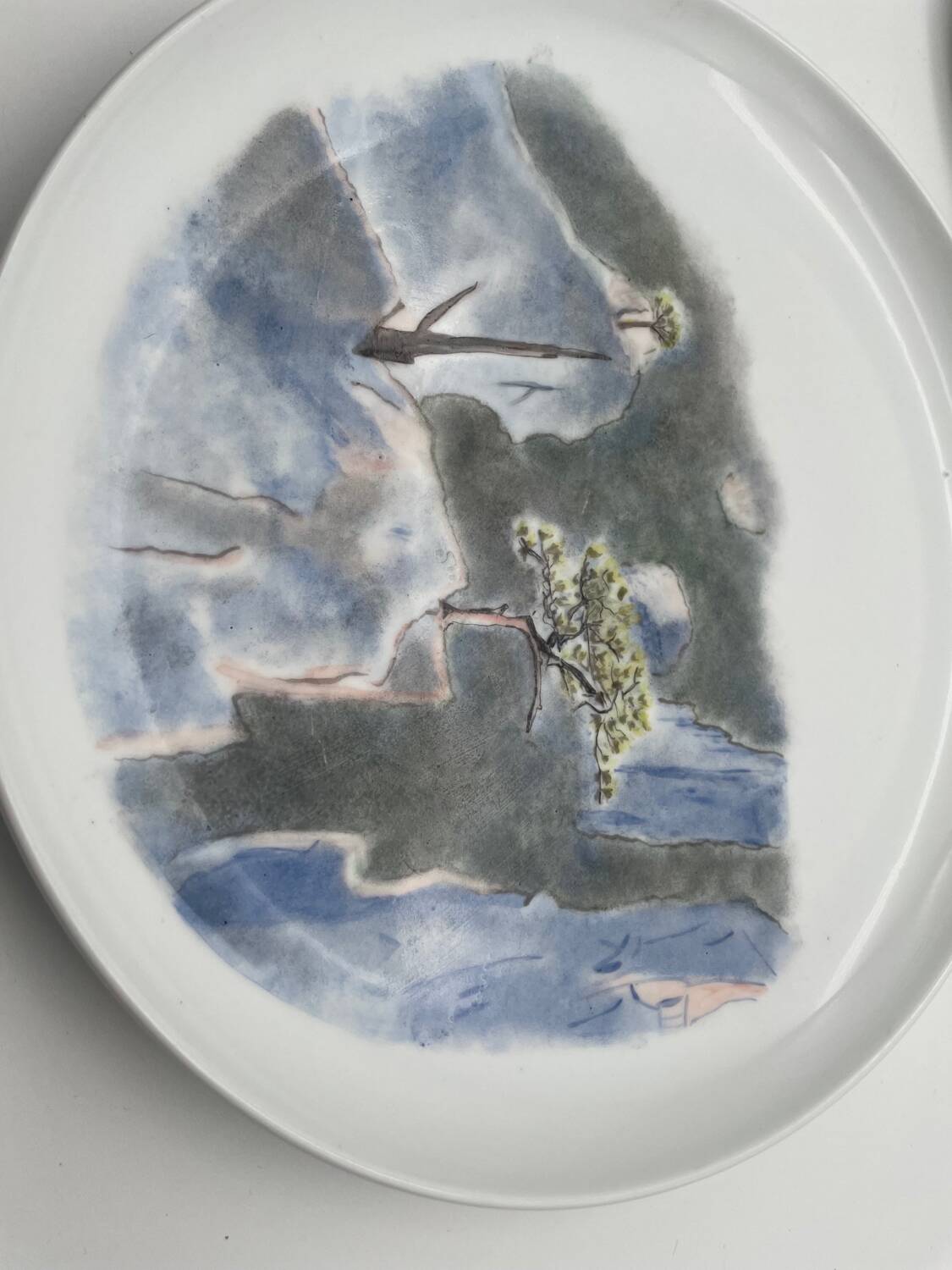 Hand painted porcelain plate with landscape decoration