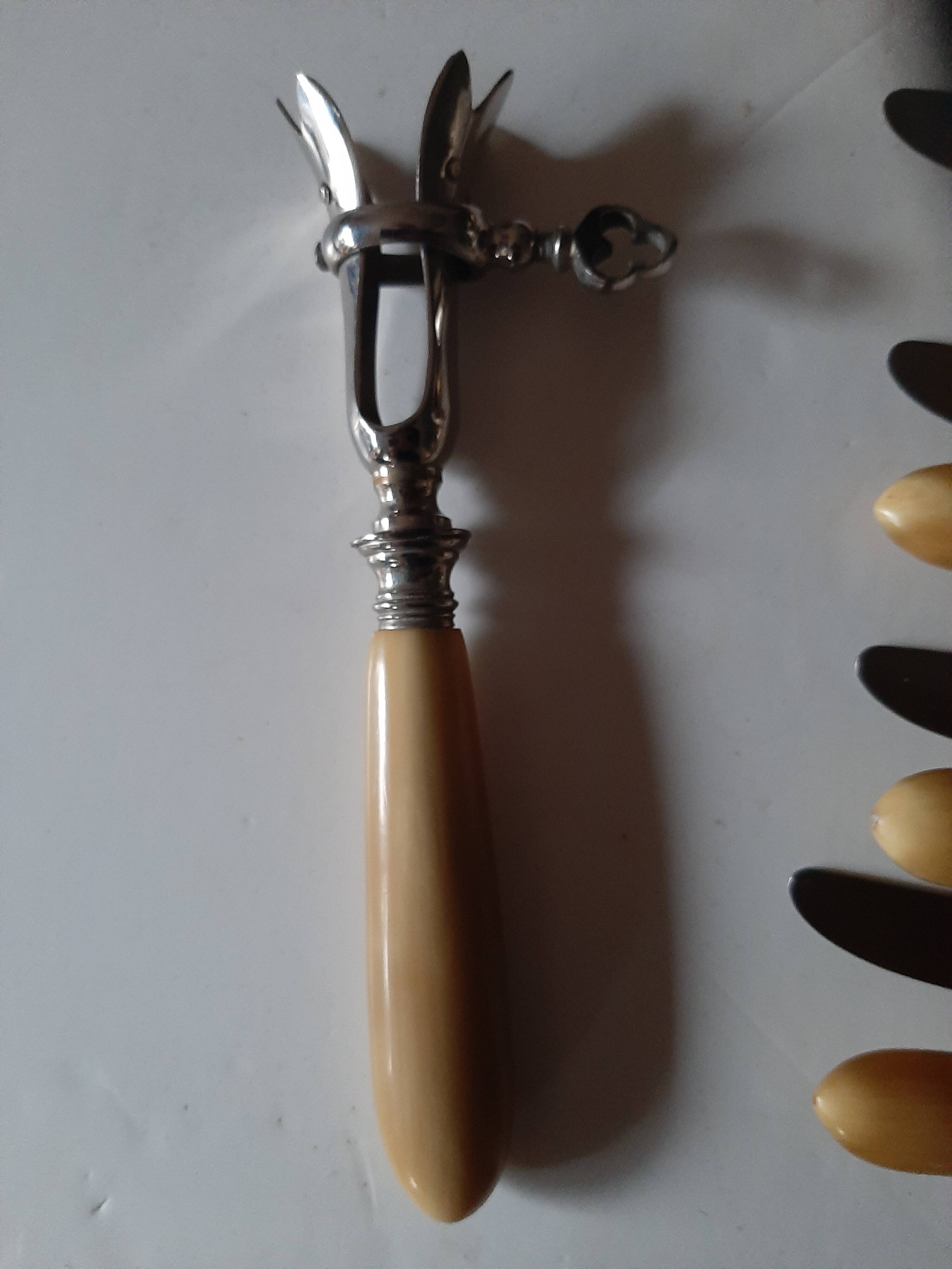 29-piece horn cutlery set, knives and serving utensils.