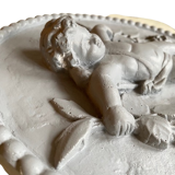 Plaster medallion cherub and garland of flowers patinated gray