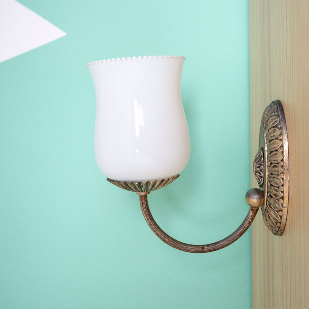 Metal wall lamp and serrated glass globe