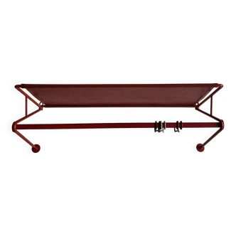 Vintage perforated red metal shelf