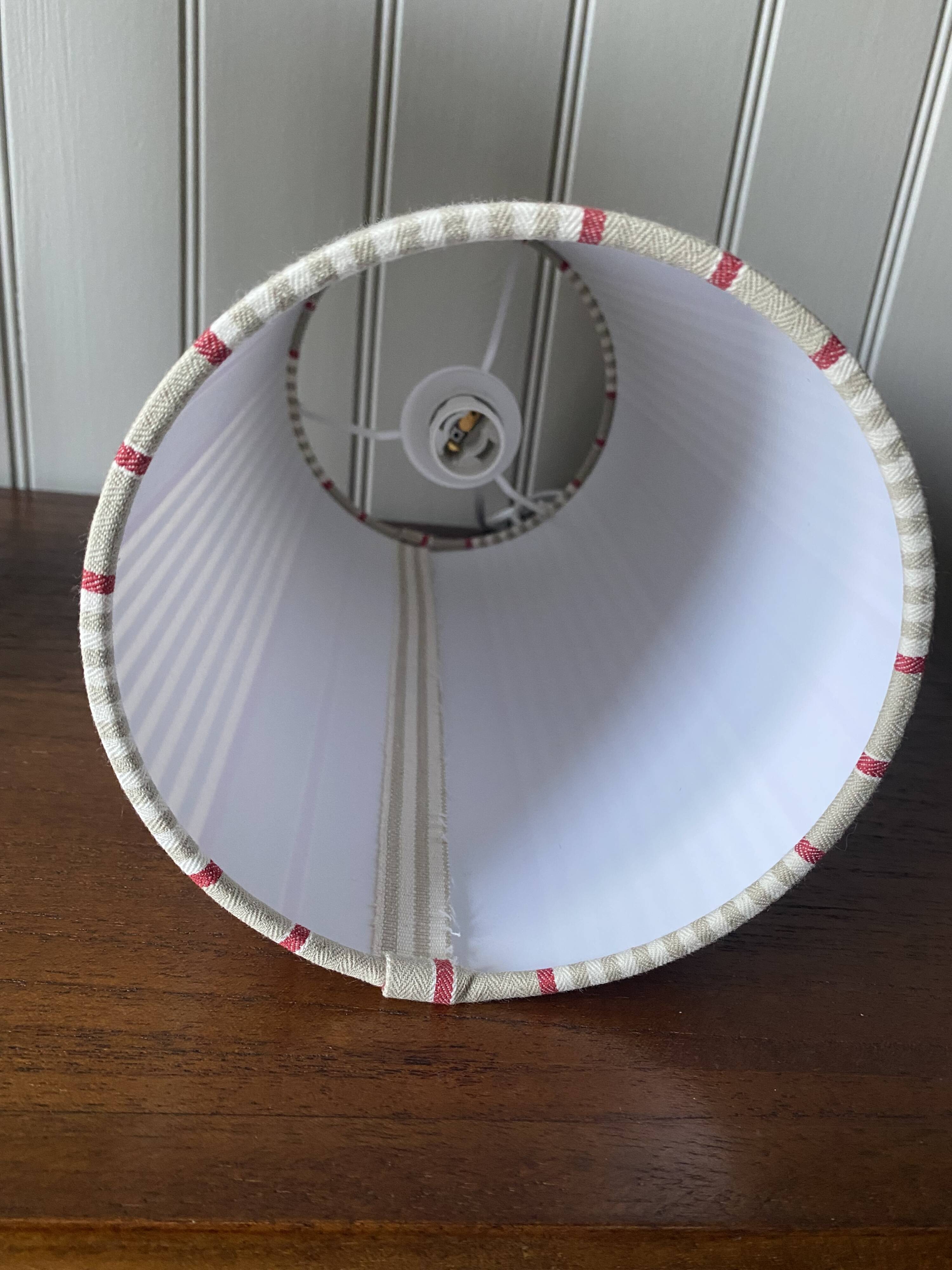 Pair of striped fabric bedside lamps.