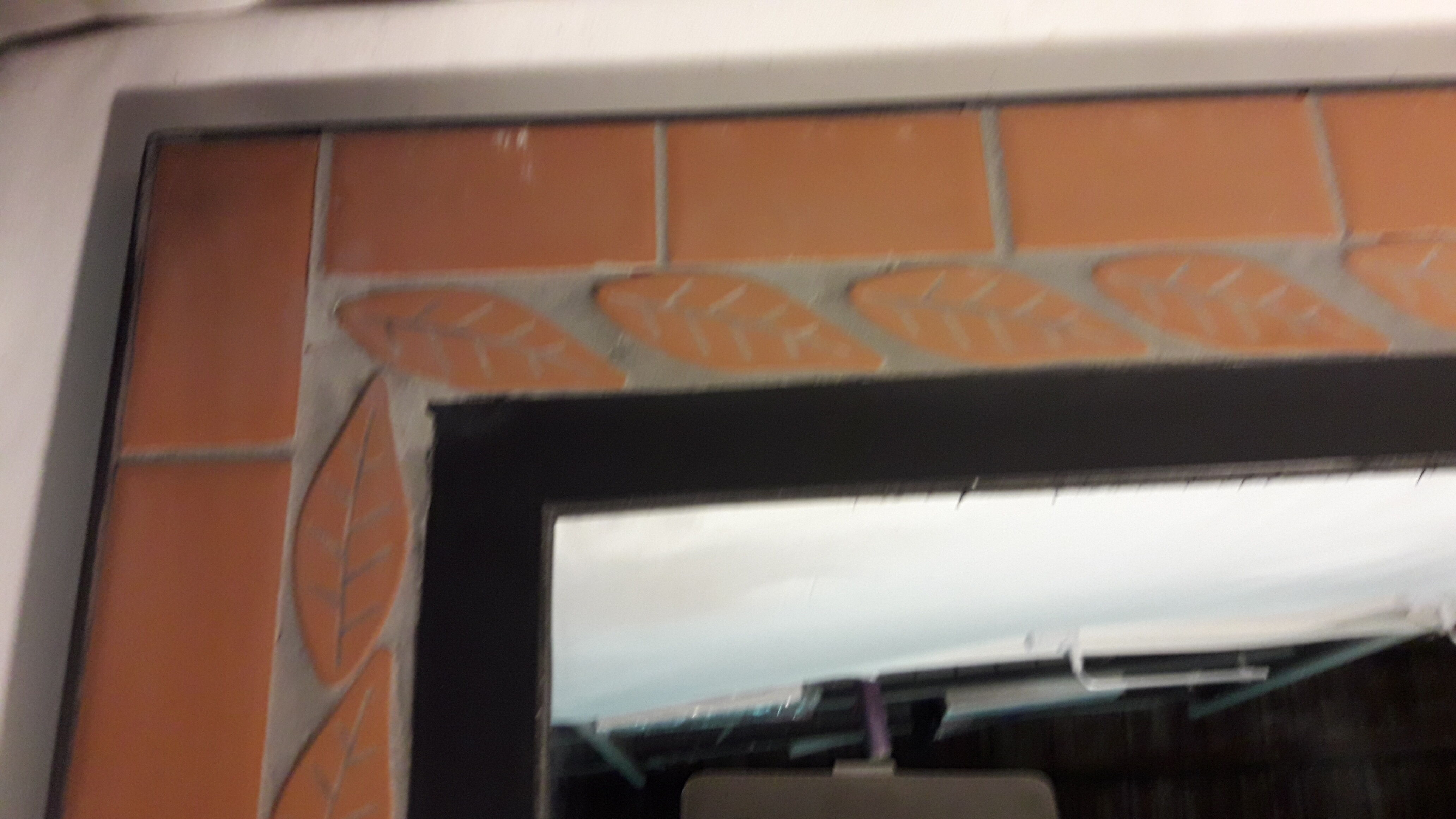 Mirror with terracotta frame