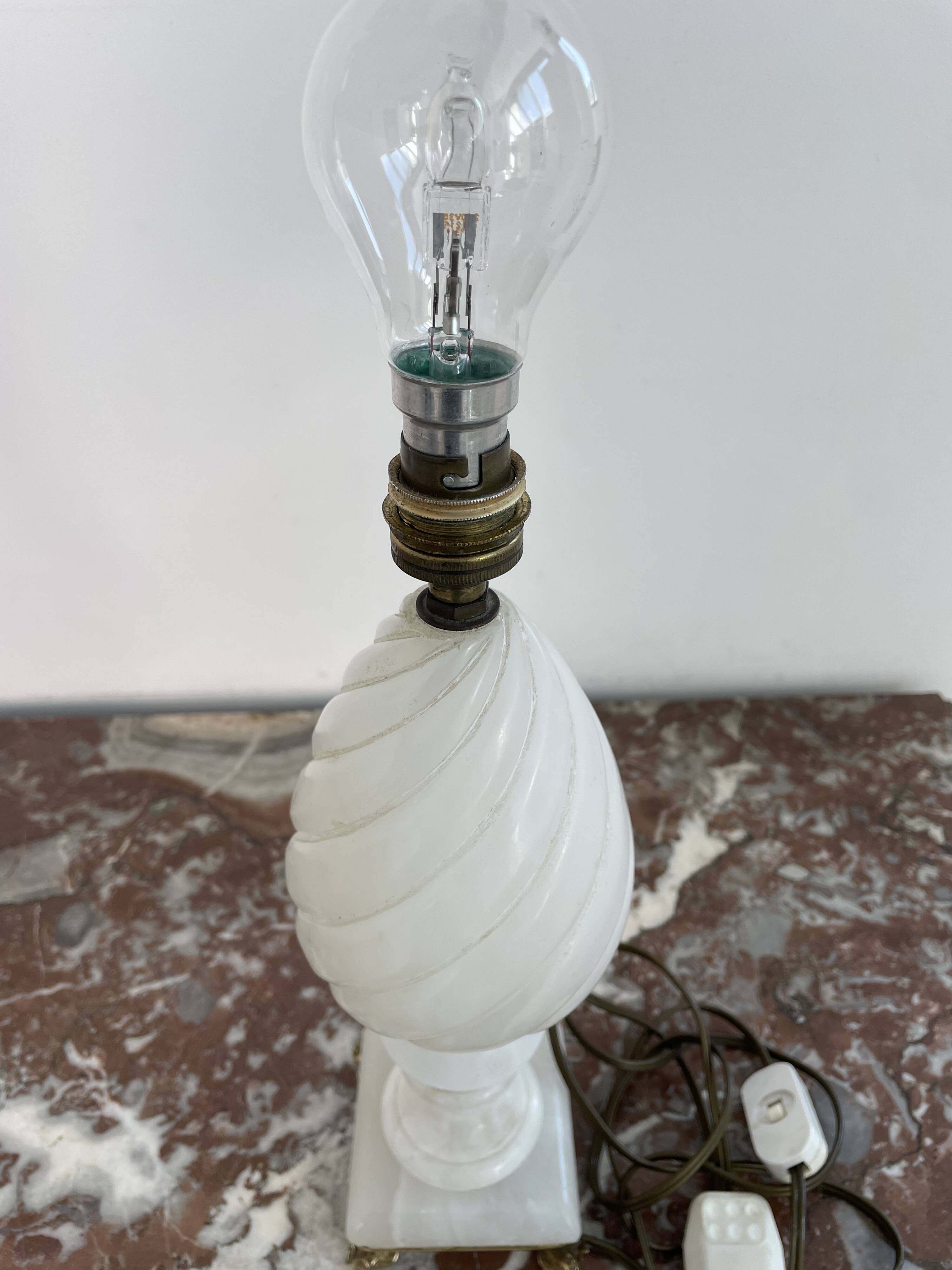 Alabaster lamp, twisted, gadroon decoration, gilded brass base, dolphins