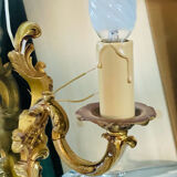 Louis XV bronze wall light with a flowing branch design and acanthus leaf decoration.