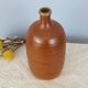 Bottle of vintage stoneware corsican brandy