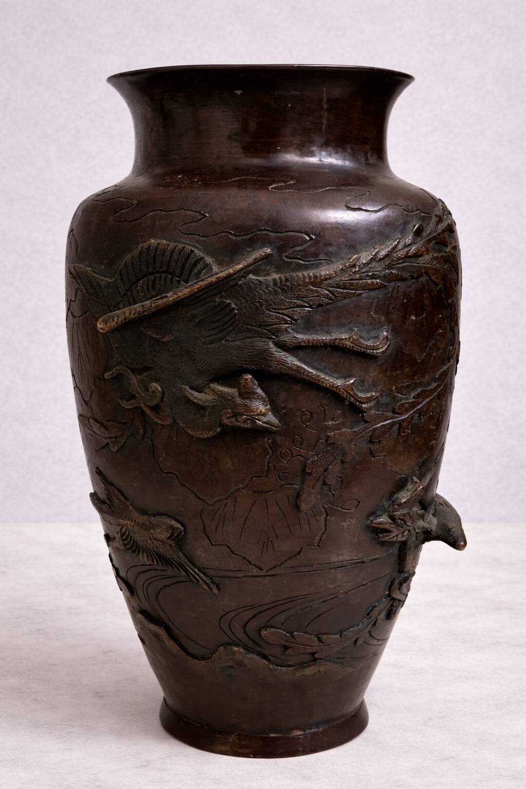 Patinated bronze vase with relief decoration