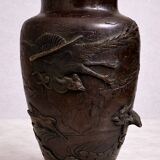 Patinated bronze vase with relief decoration