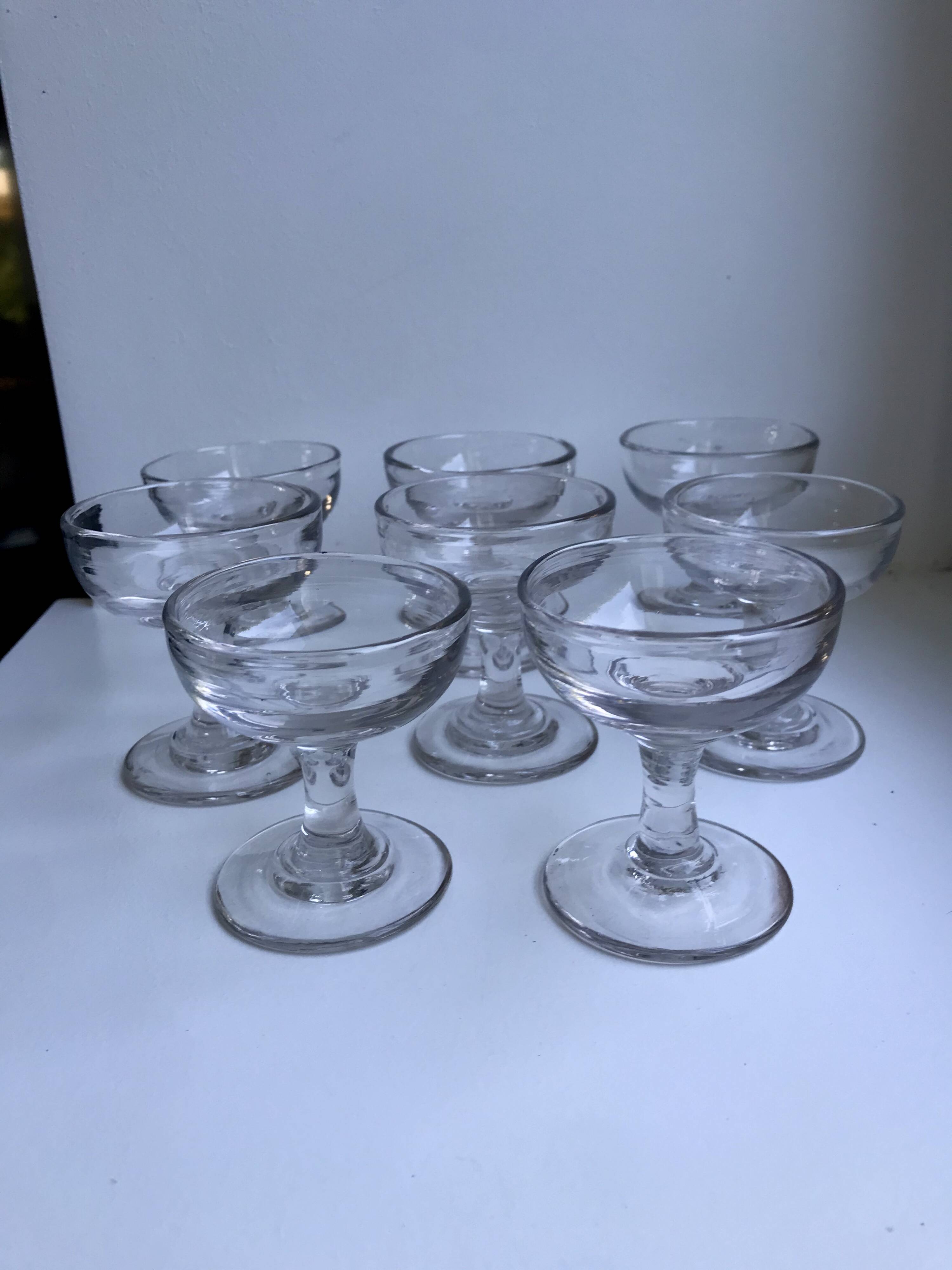 set of 9 small molded glass shot glasses early twentieth century