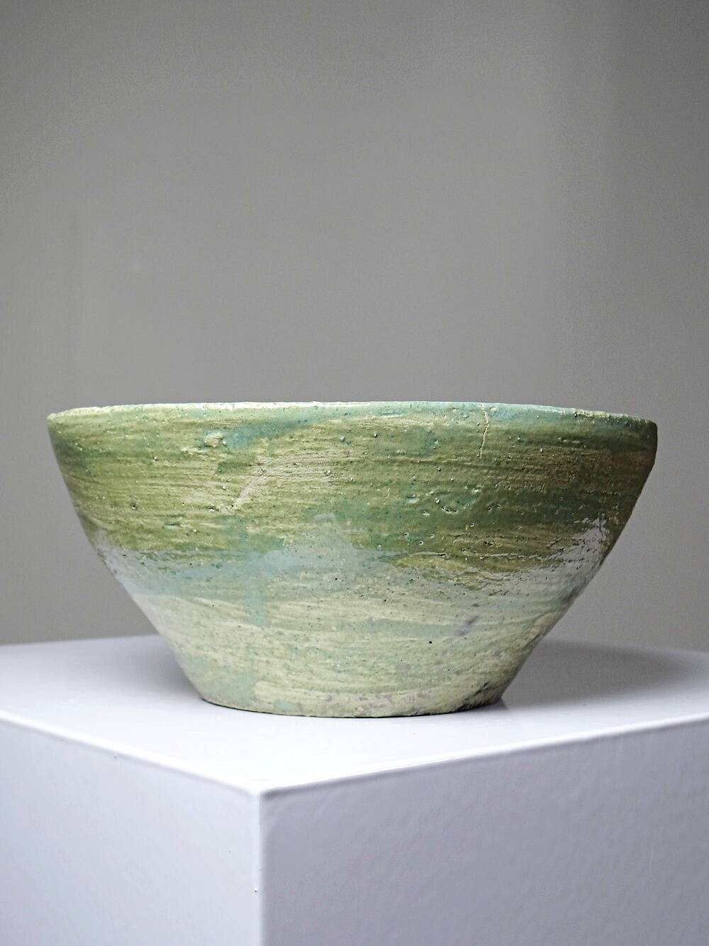 Wabi-Sabi handcrafted ceramic bowl in celadon green, 20th-19th century.