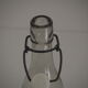Bottle with mechanical closure in white glass and porcelain stopper.