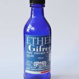 Blue glass bottle of ether