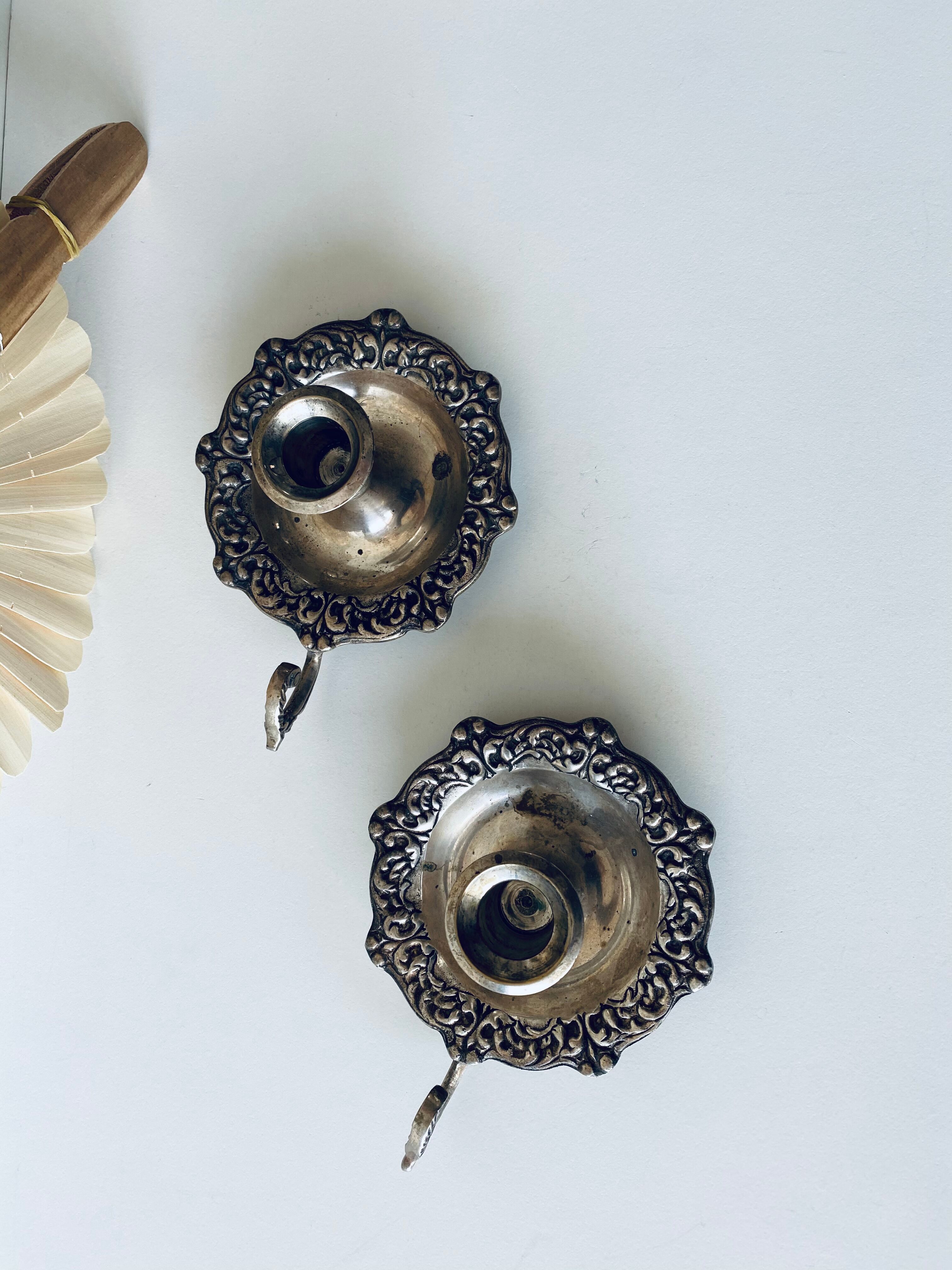 Pair of silver metal candlesticks