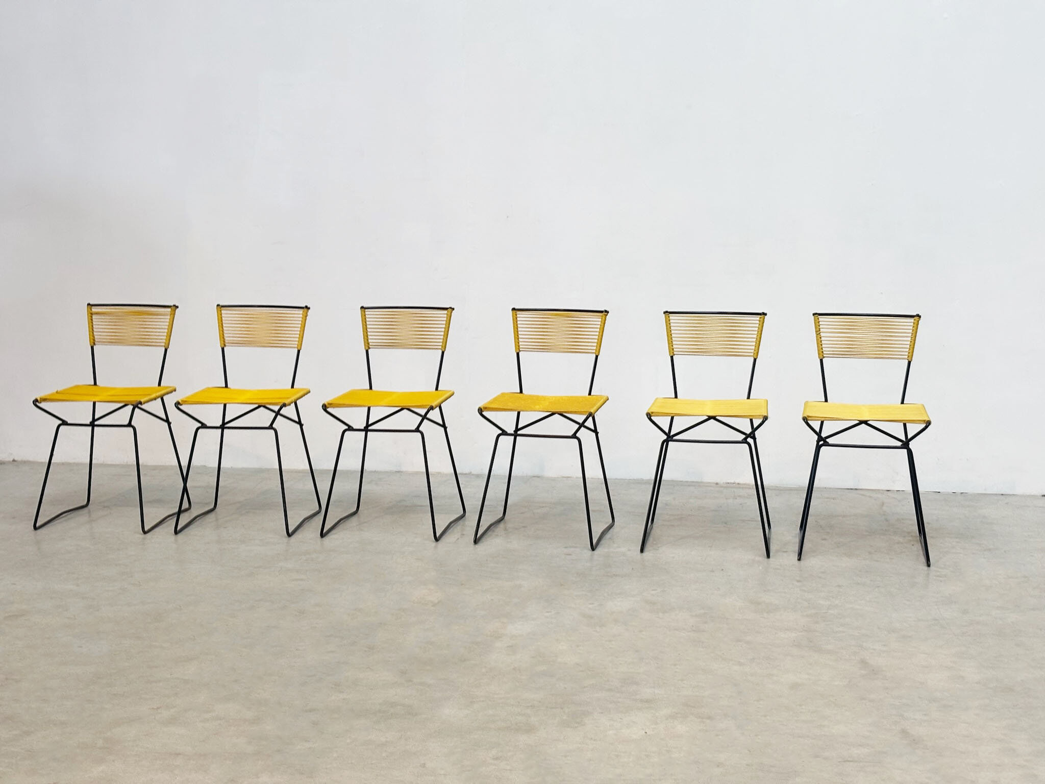 Set of six 'Spaghetti' dining chairs