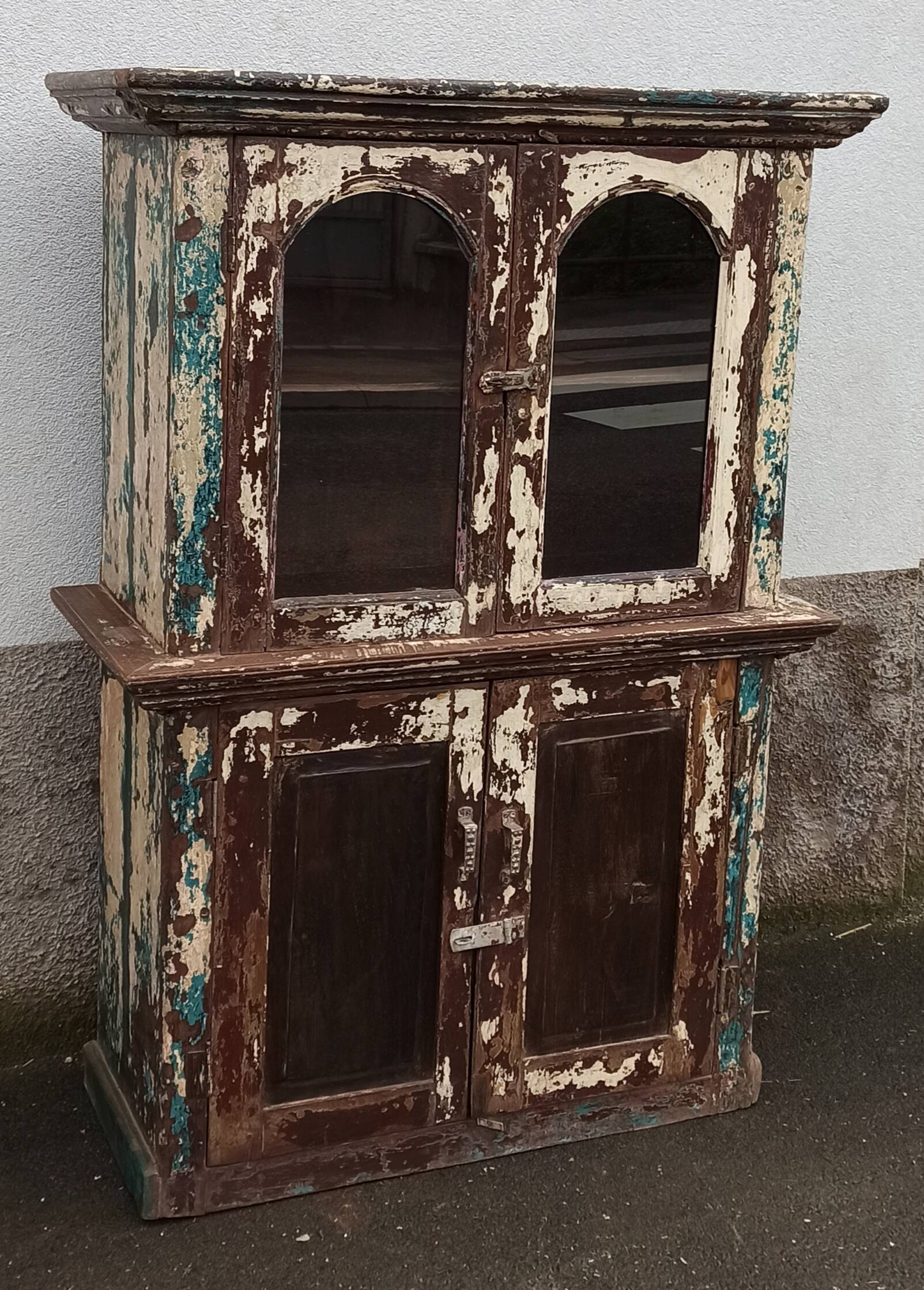 Old patinated wooden glass cabinet