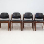 Set of four Arne Vodder chairs in hardwood and black leather.