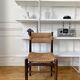 Wooden chair and brutalist straw