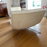 Two armchairs and a pop footstool from Roset