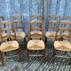 8 antique Vendée straw chairs in solid cherry wood.
