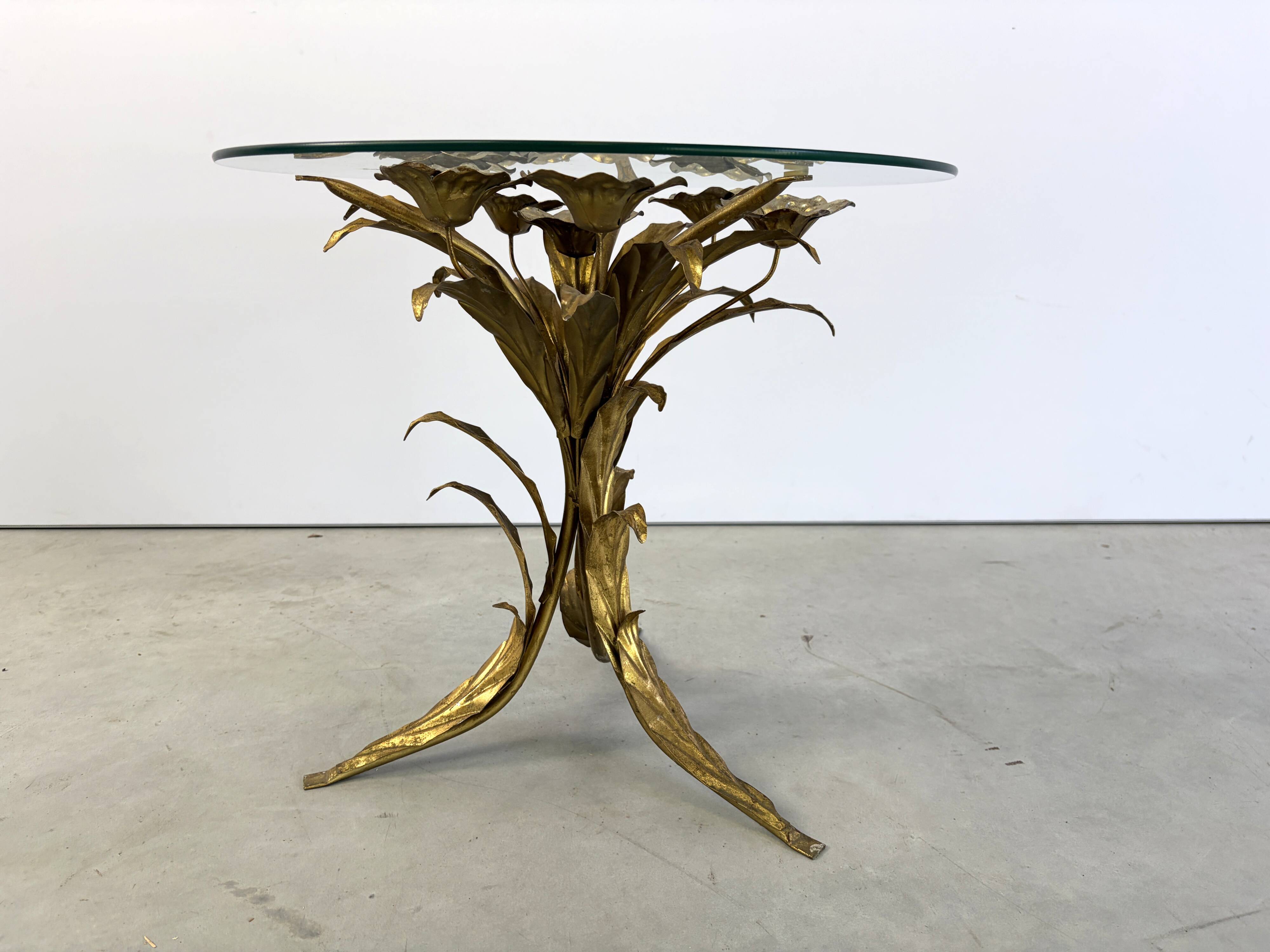 Charming metal flower coffee table or side table with a clear glass top. Made in Italy, attributed to Hans Kögl.