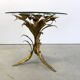 Charming metal flower coffee table or side table with a clear glass top. Made in Italy, attributed to Hans Kögl.