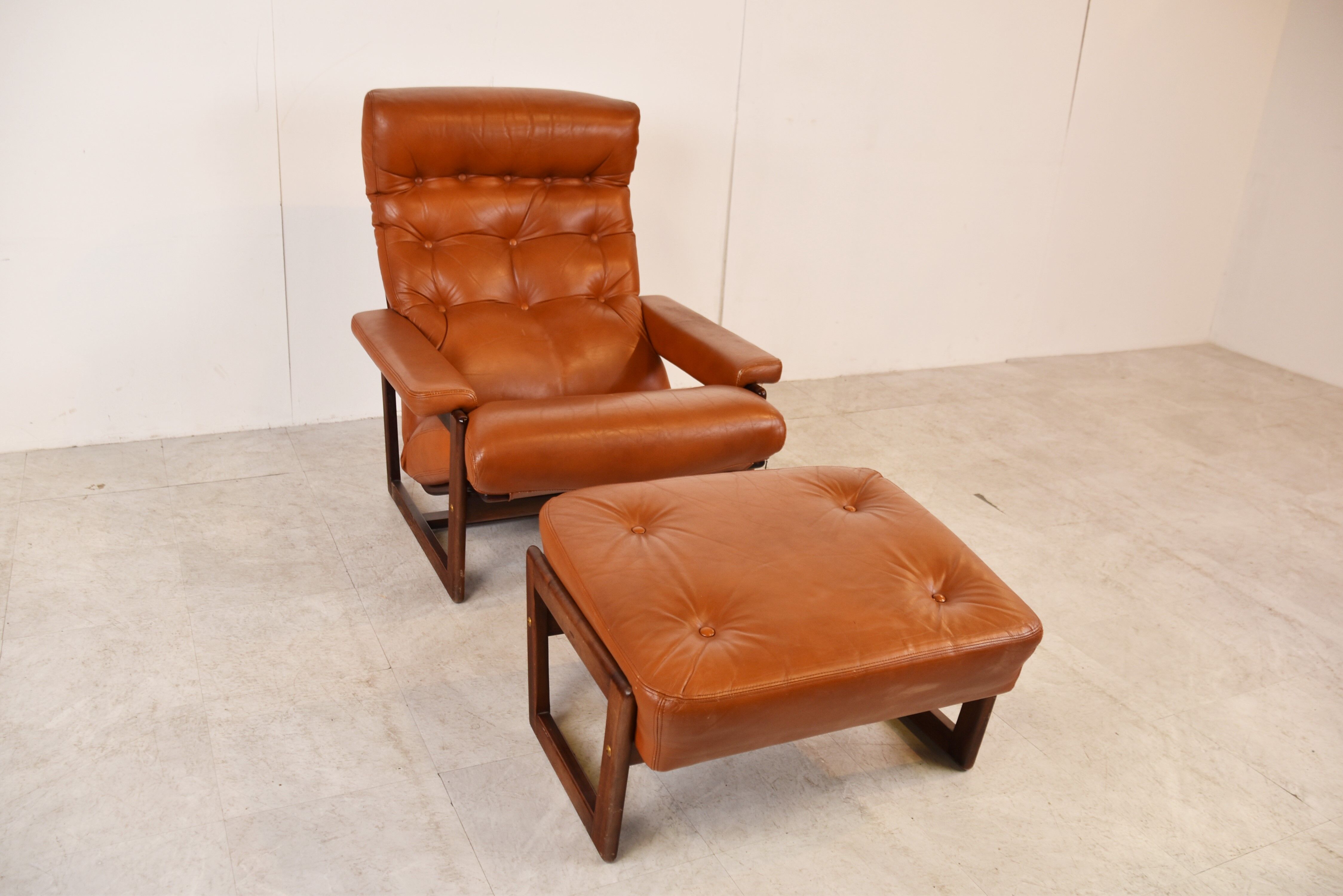 Vintage leather armchair with hocker, 1970s