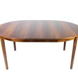Dining table in rosewood with three extension plates, of danish design from the 1960s.